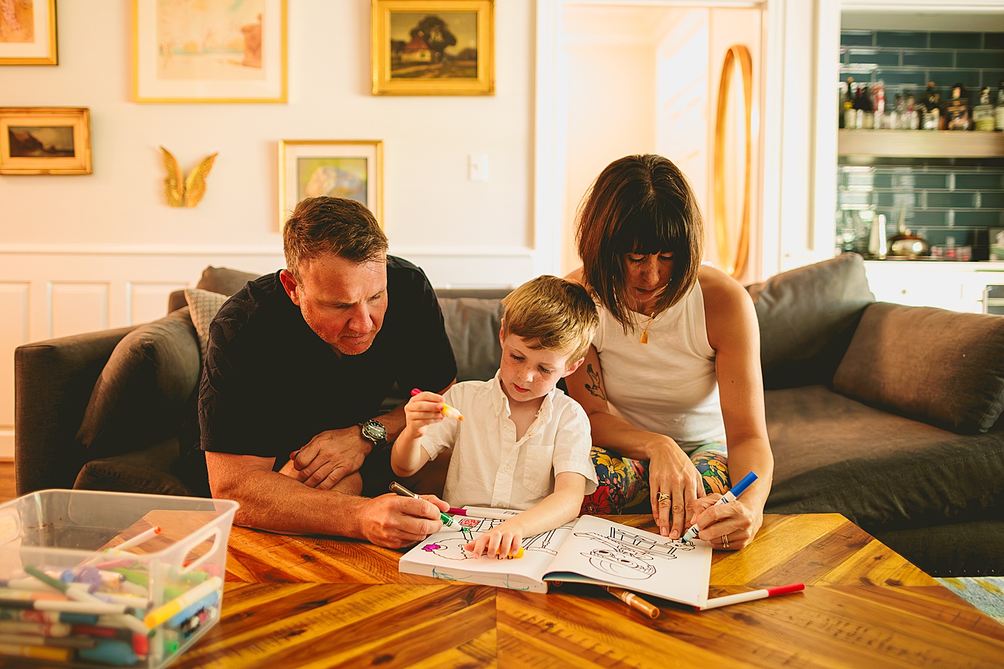 Boy coloring in living room