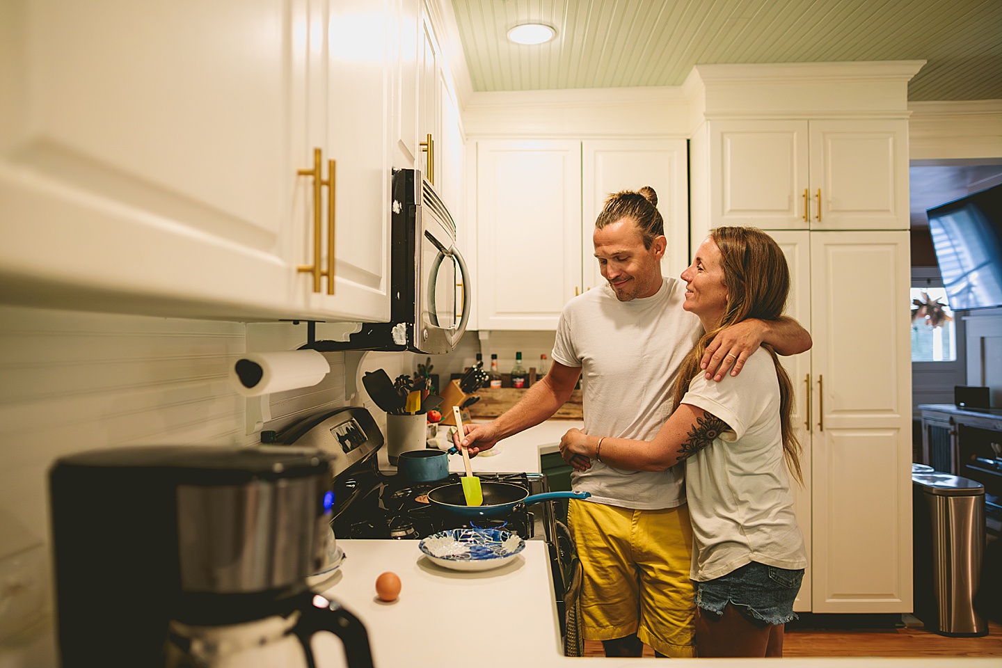 Couple cooking inside home