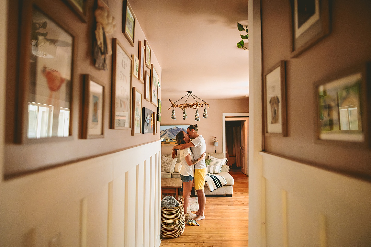 Couple kissing in entryway of house