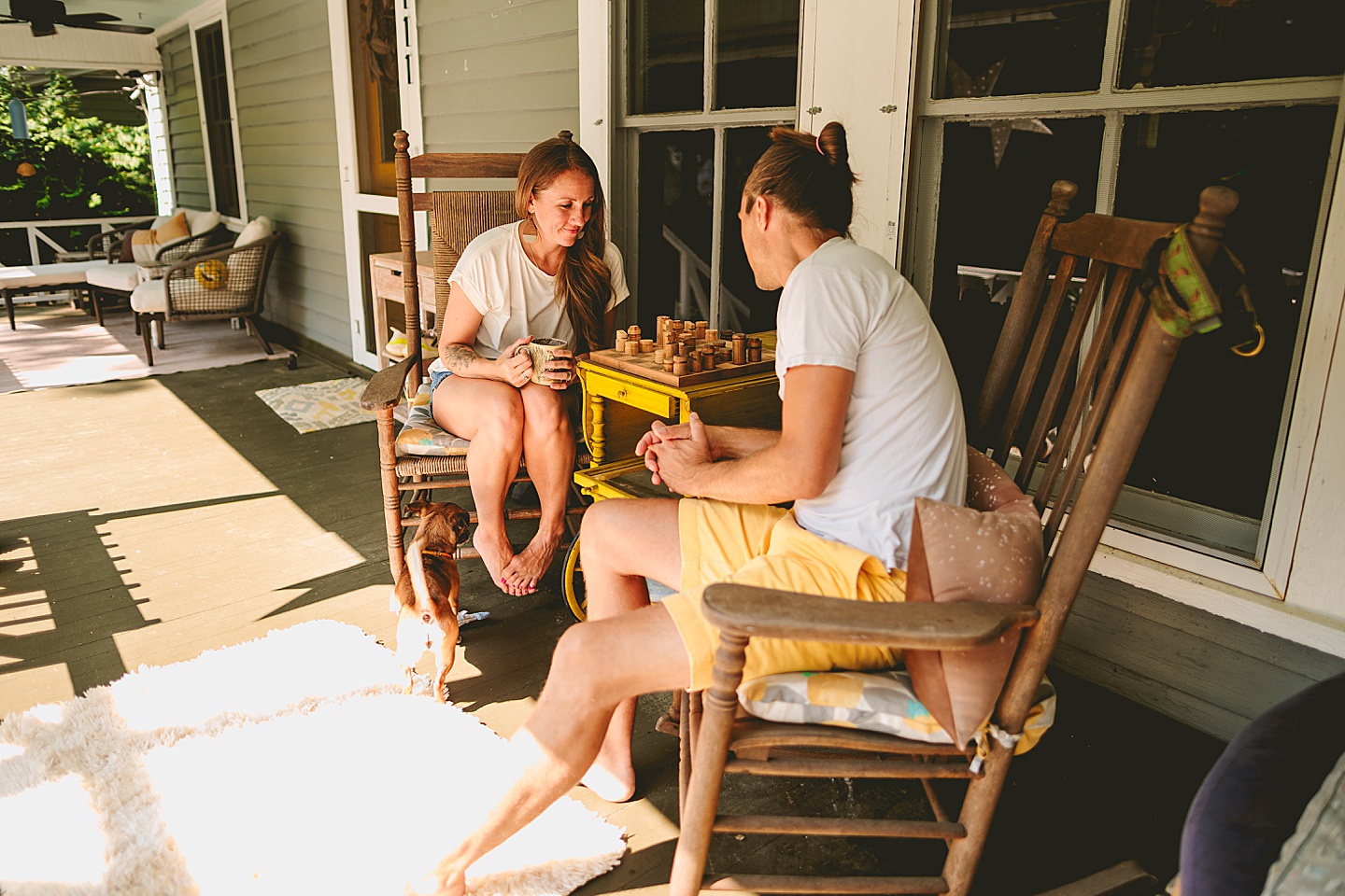 Couple playing chess on porch