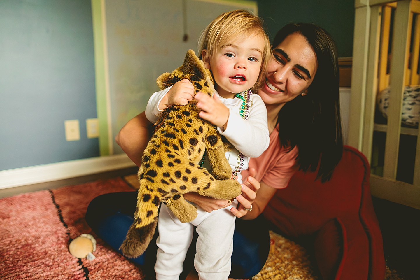 Toddler hugging stuffed animals