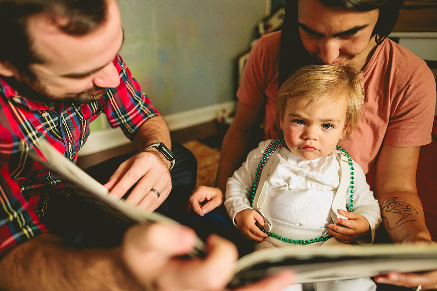 Family reading books to baby