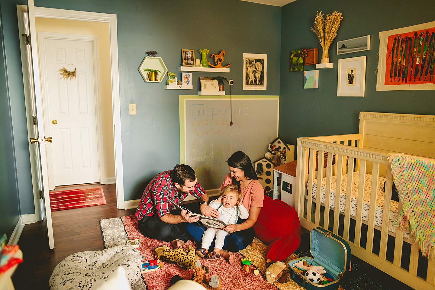 Family reading books to baby