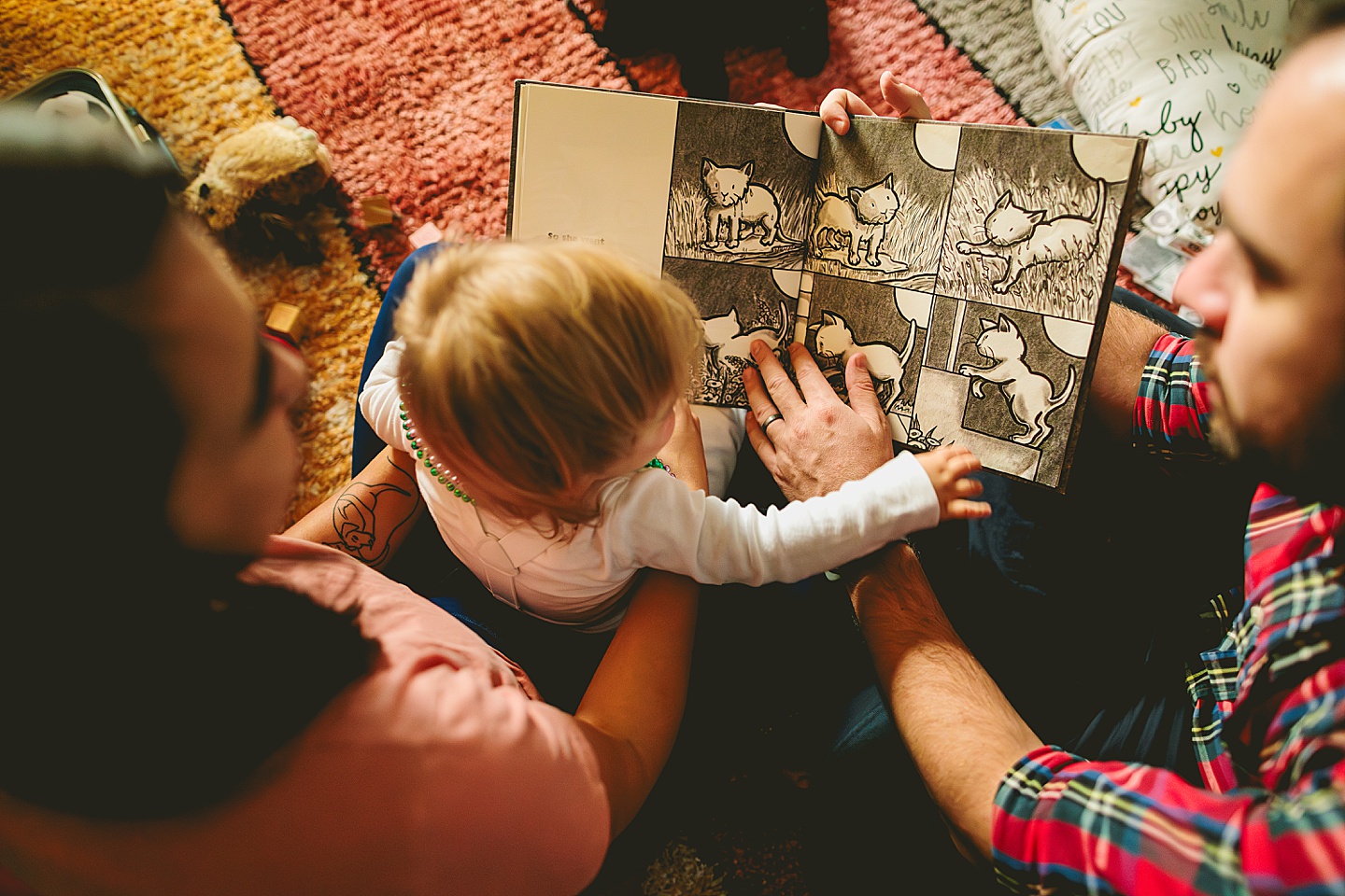 Family reading books to baby