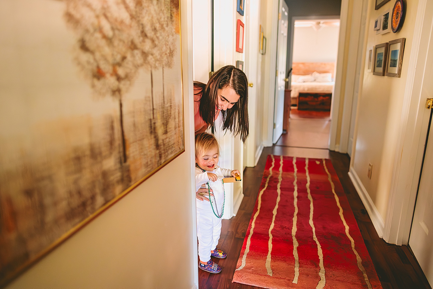 Mom marking height of child against a wall