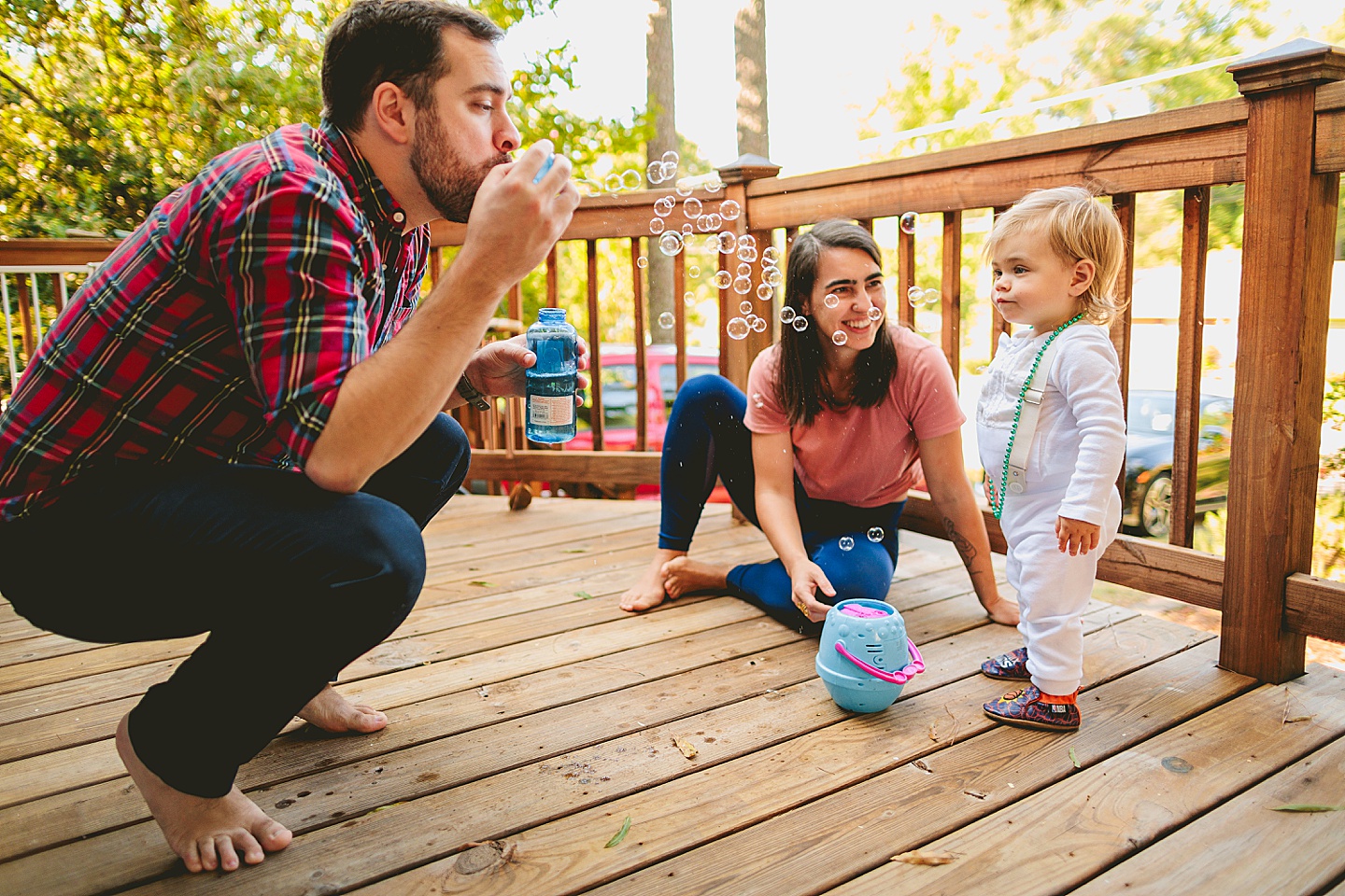 Blowing bubbles at toddler