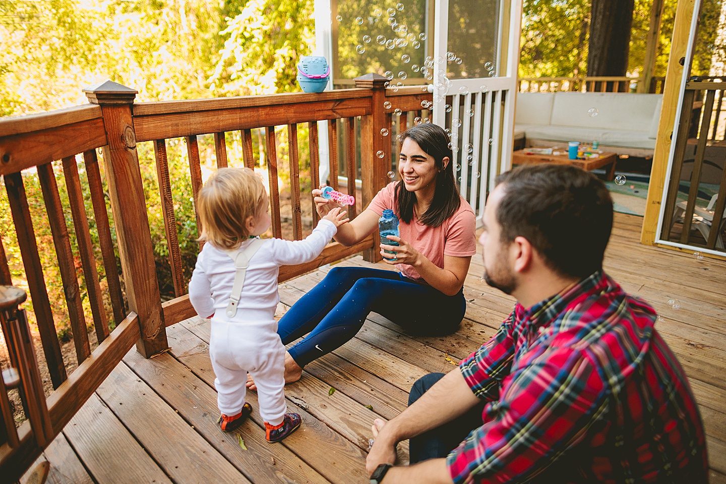 Blowing bubbles at toddler