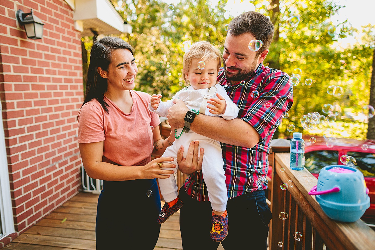 Blowing bubbles at toddler