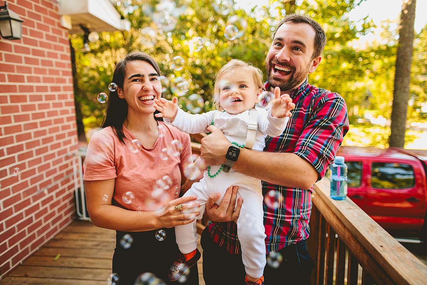 Blowing bubbles at toddler