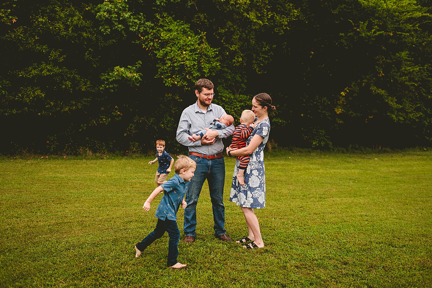 Durham family photographer with kids running around