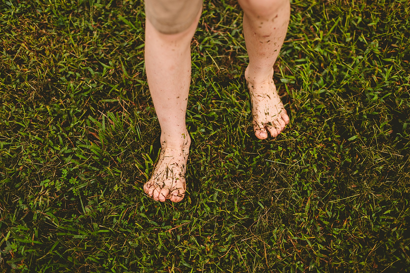 Kid with grassy feet