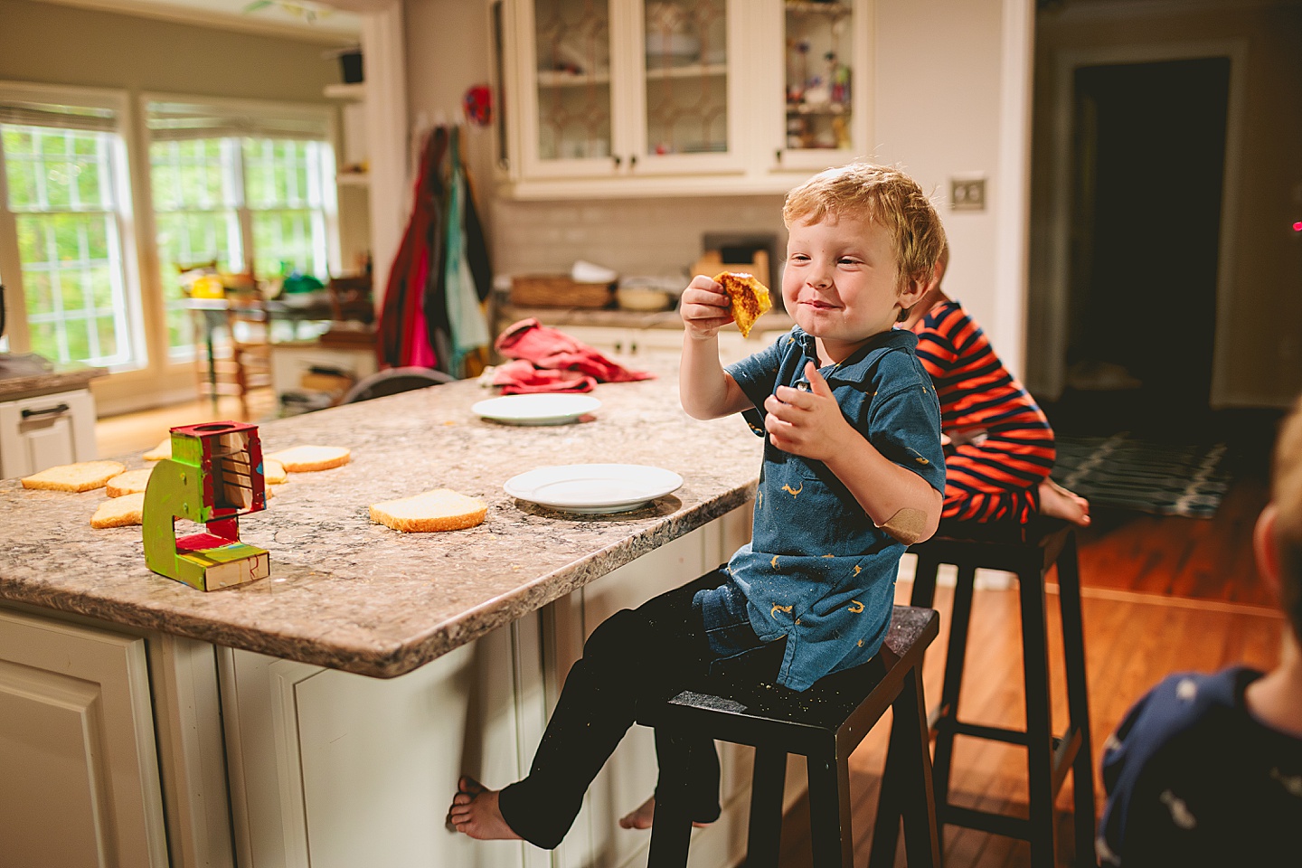 Kids in the kitchen making french toast for photos