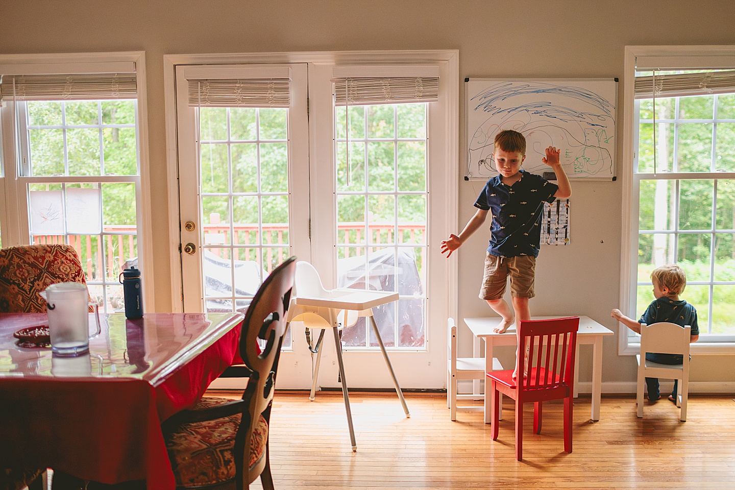 Kid sitting by the window