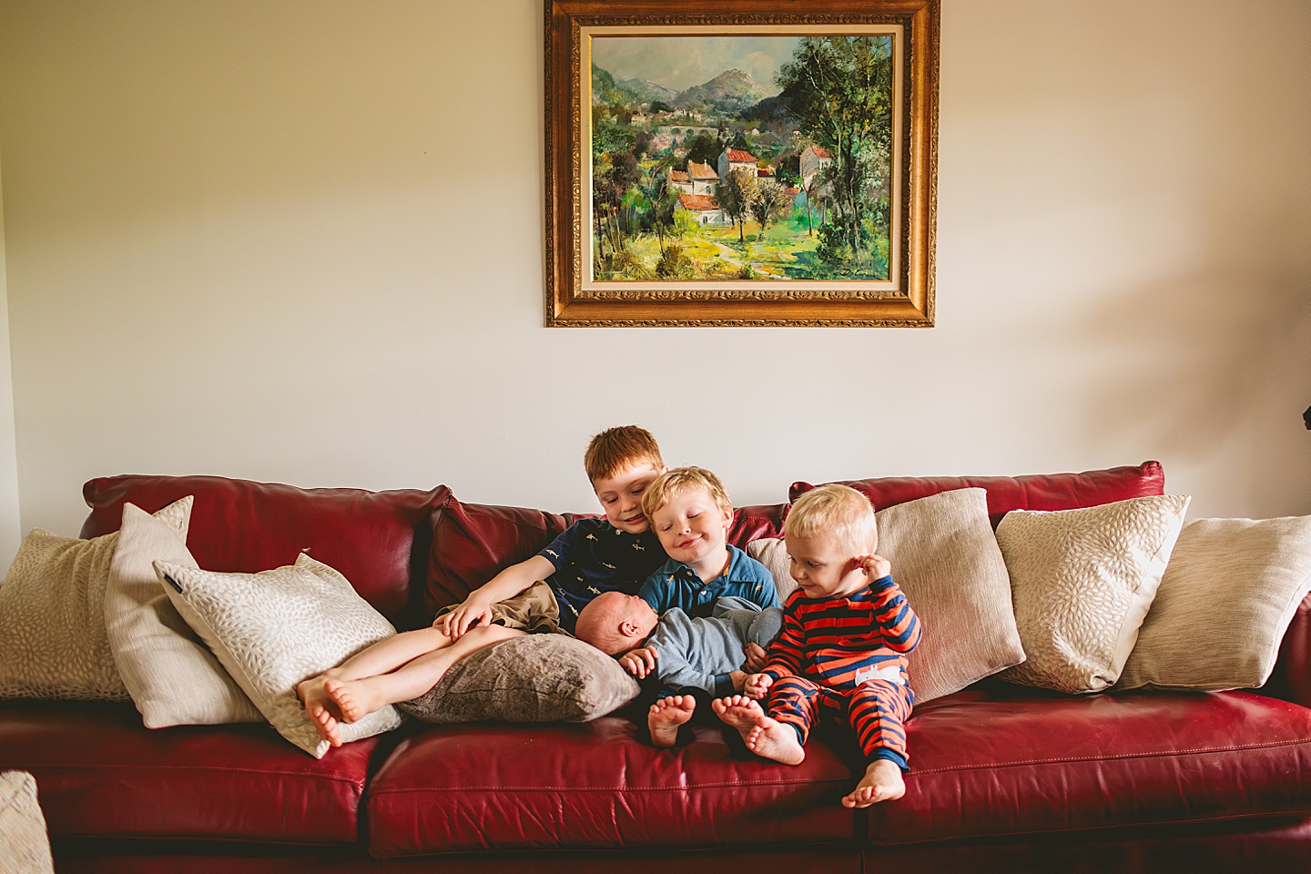 Brothers get portrait taken together on couch