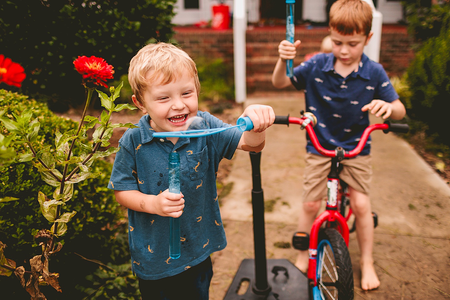 Kids playing with bubbles outside