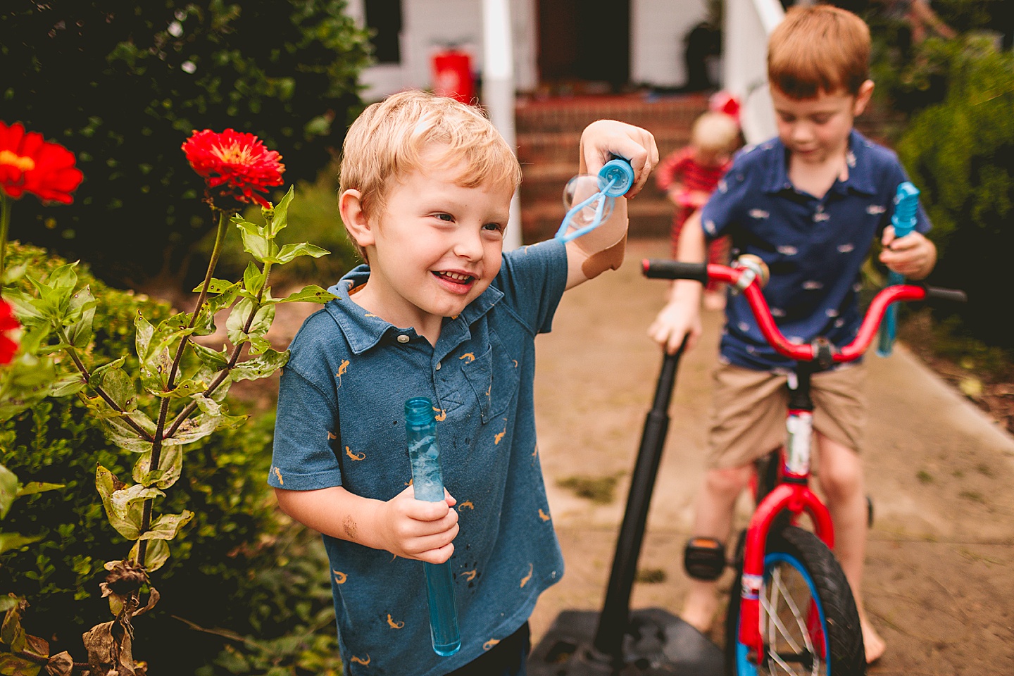 Kids playing with bubbles outside