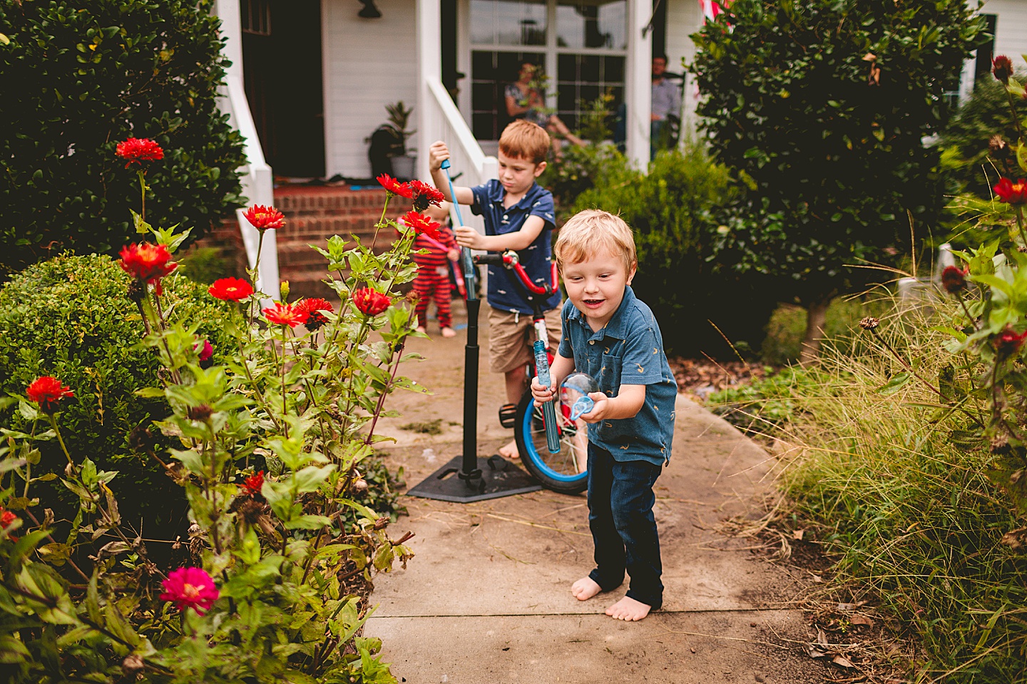 Kids playing with bubbles outside