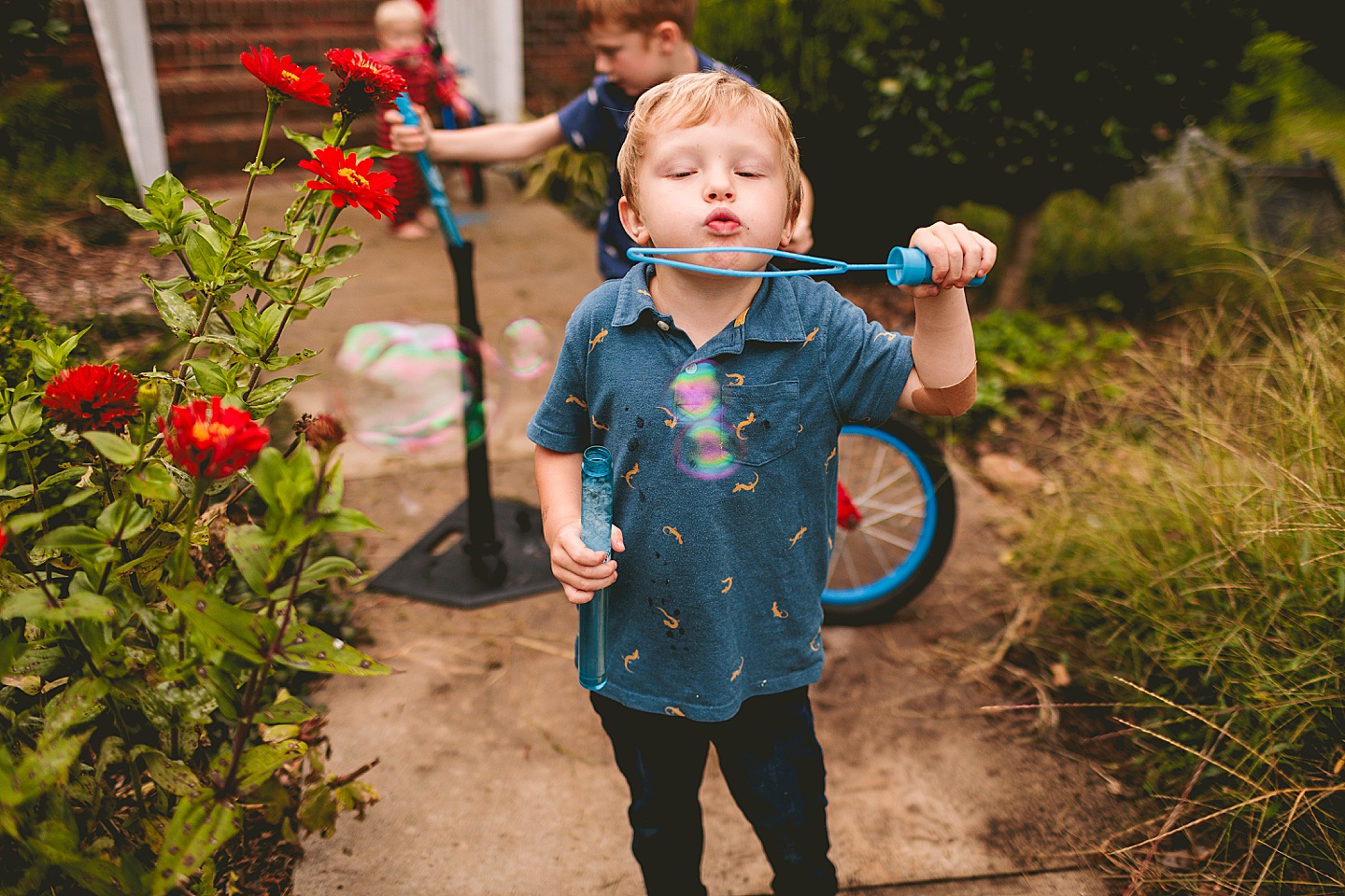 Kids playing with bubbles outside
