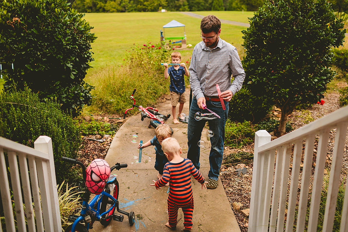 Kids playing with bubbles outside