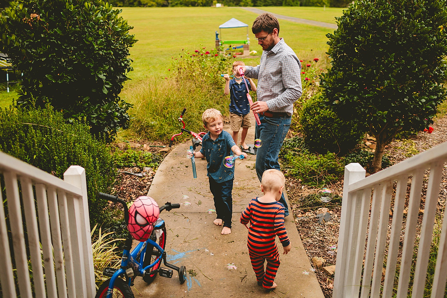 Kids playing with bubbles outside