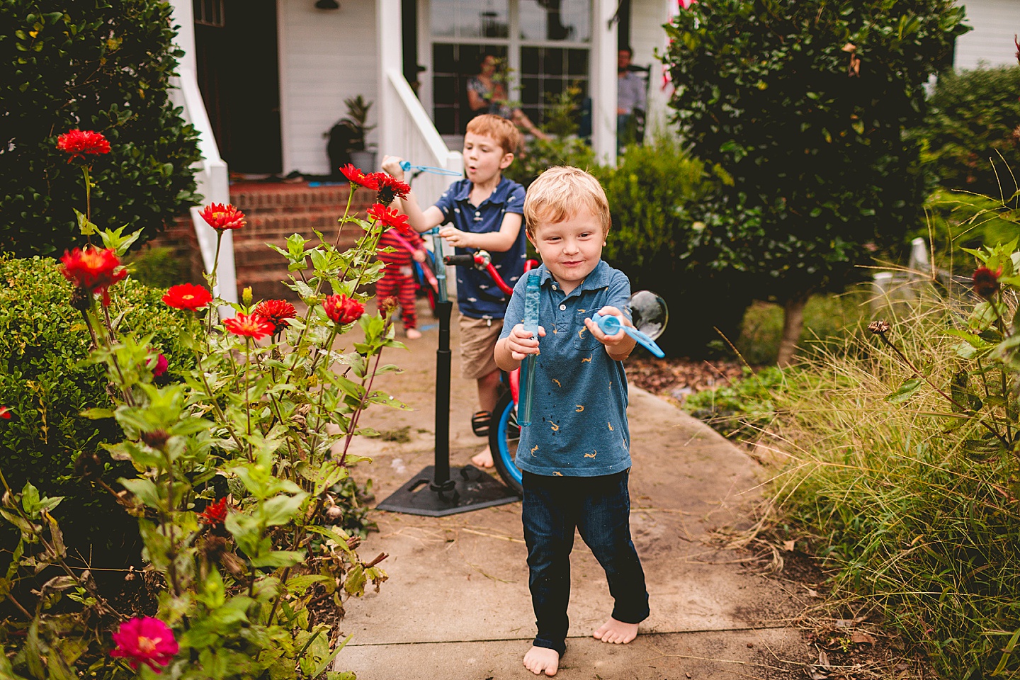 Kids playing with bubbles outside