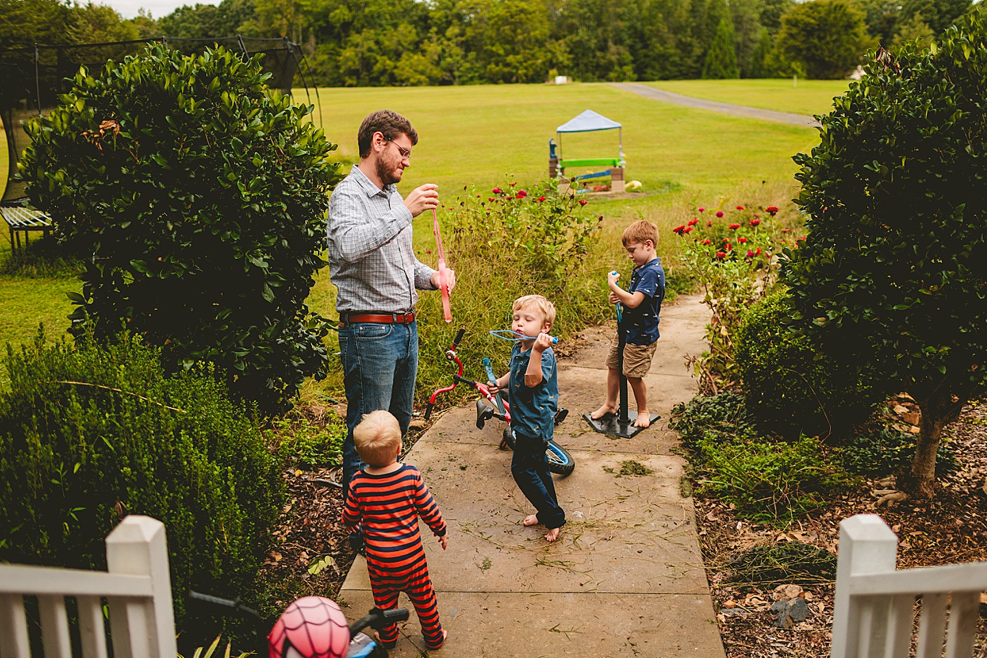 Kids playing with bubbles outside