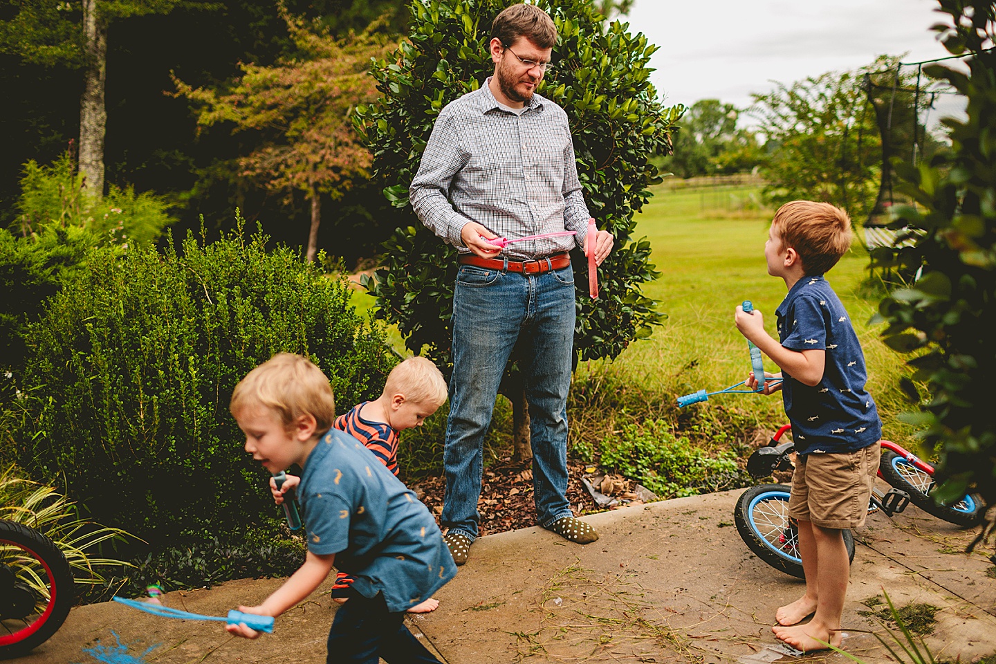 Kids playing with bubbles outside