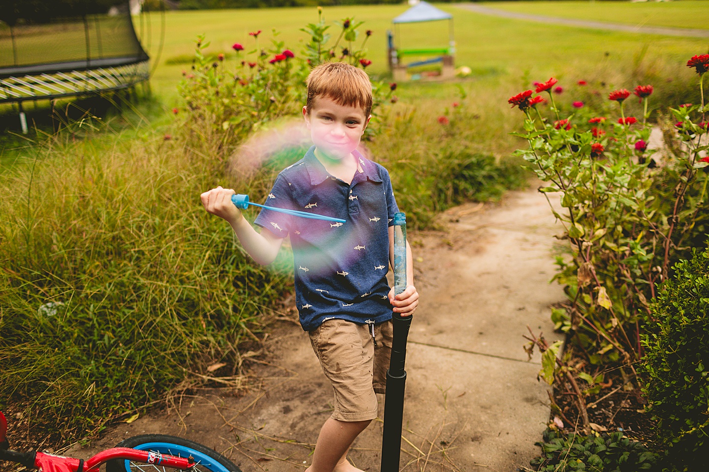 Kids playing with bubbles outside