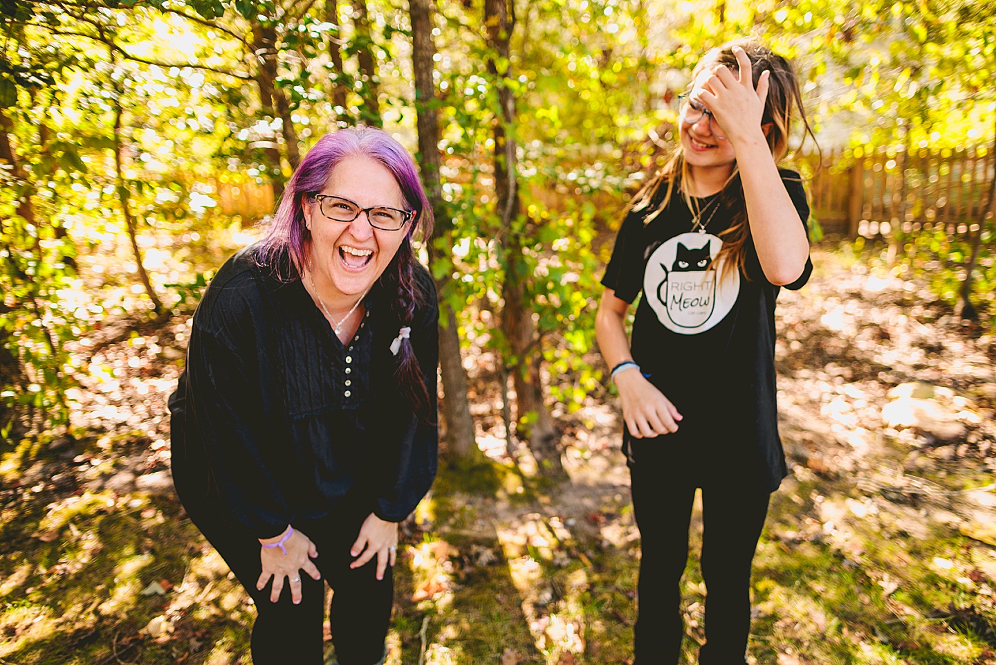 Mother and daughter laughing during family photos in Holly Springs 