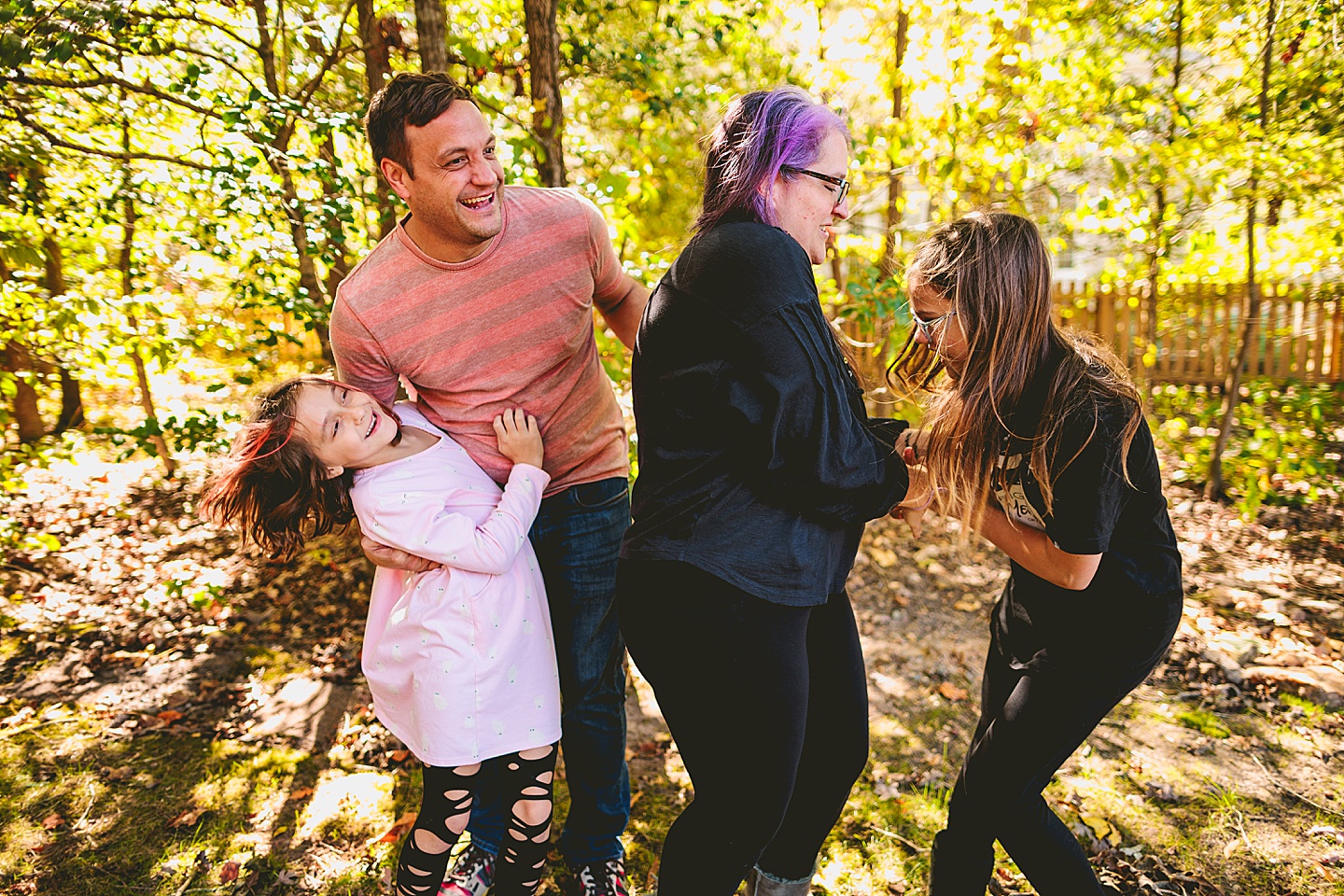 Family laughing during Holly Springs family photos