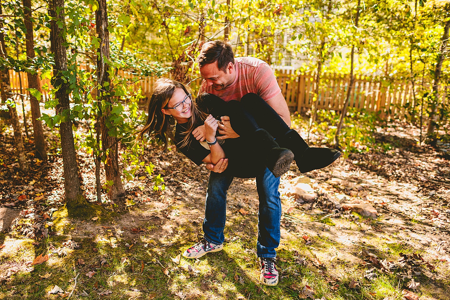 Father picking up daughter outside in North Carolina