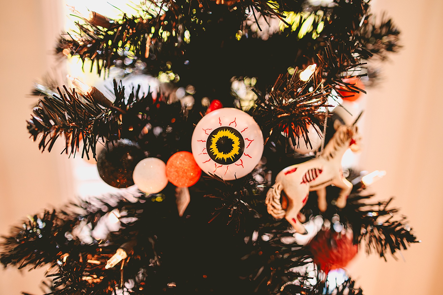 Eyeball horror ornament hangs on tree