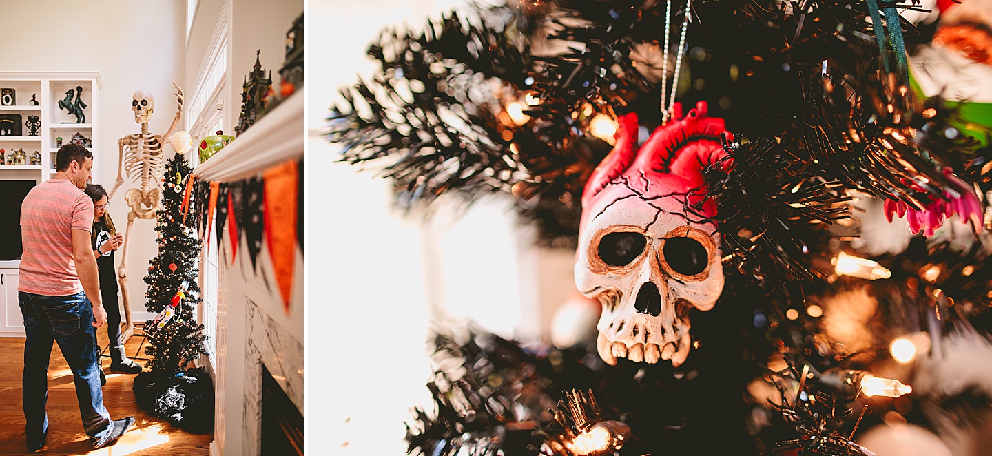 Skull heart ornament hangs on black Christmas tree